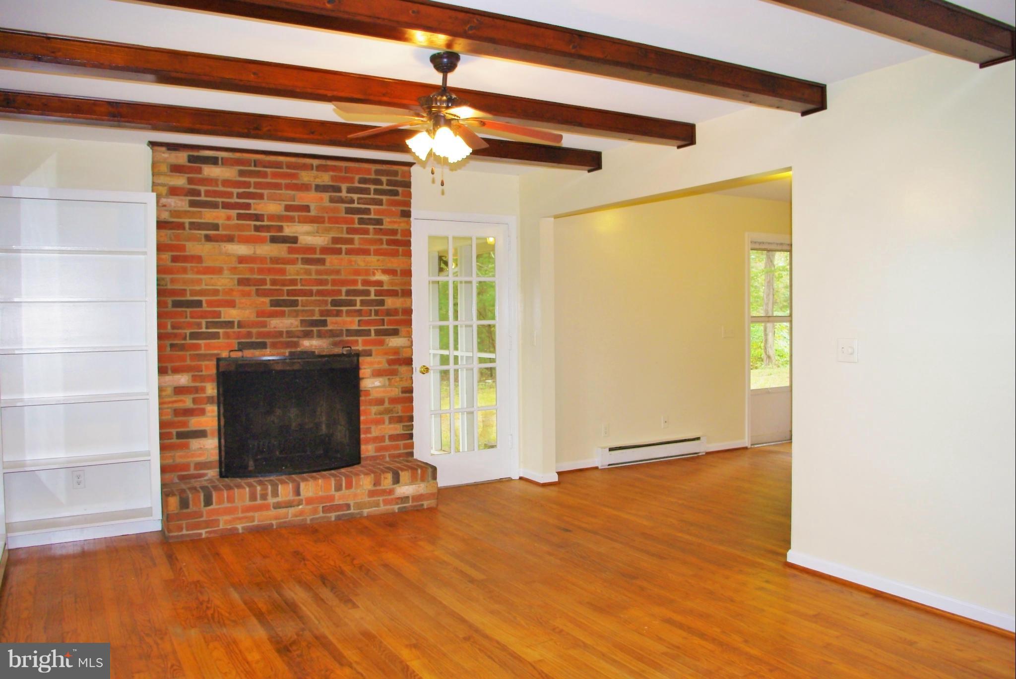 353 Aaron Mountain Road Castleton, VA 22716 - Photo 14 of 23 Living has beams and a large fireplace
