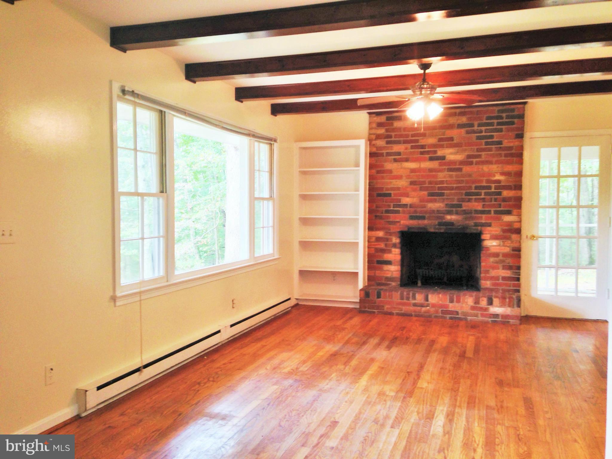 353 Aaron Mountain Road Castleton, VA 22716 - Photo 15 of 23 Living room with access to screened porch