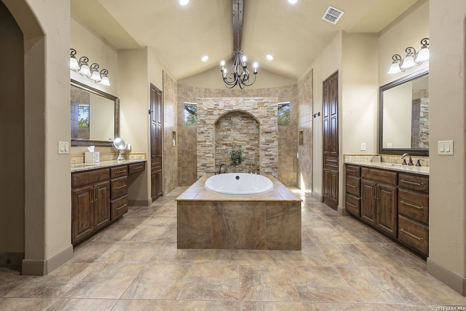 1941 Canyon Spring Branch, TX 78070 - Photo 27 of 86 a large kitchen with kitchen island a stove a sink a center island and stainless steel appliances
