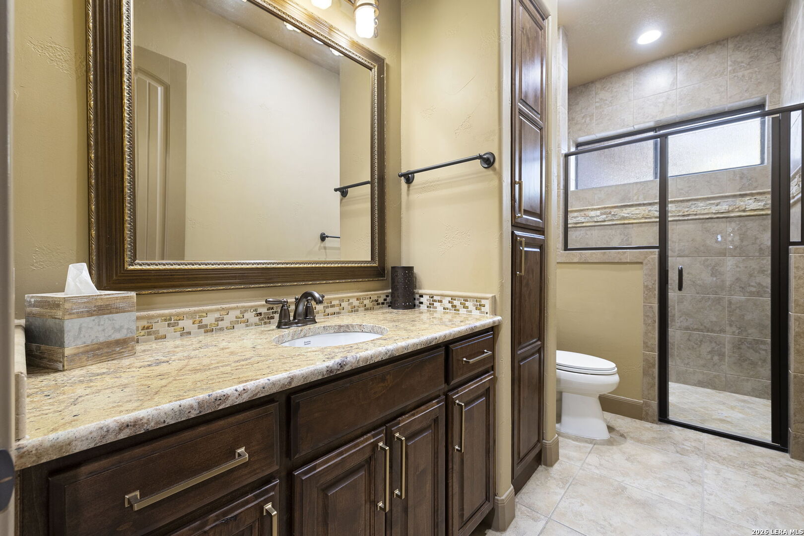 1941 Canyon Spring Branch, TX 78070 - Photo 30 of 86 a bathroom with a granite countertop sink toilet and shower