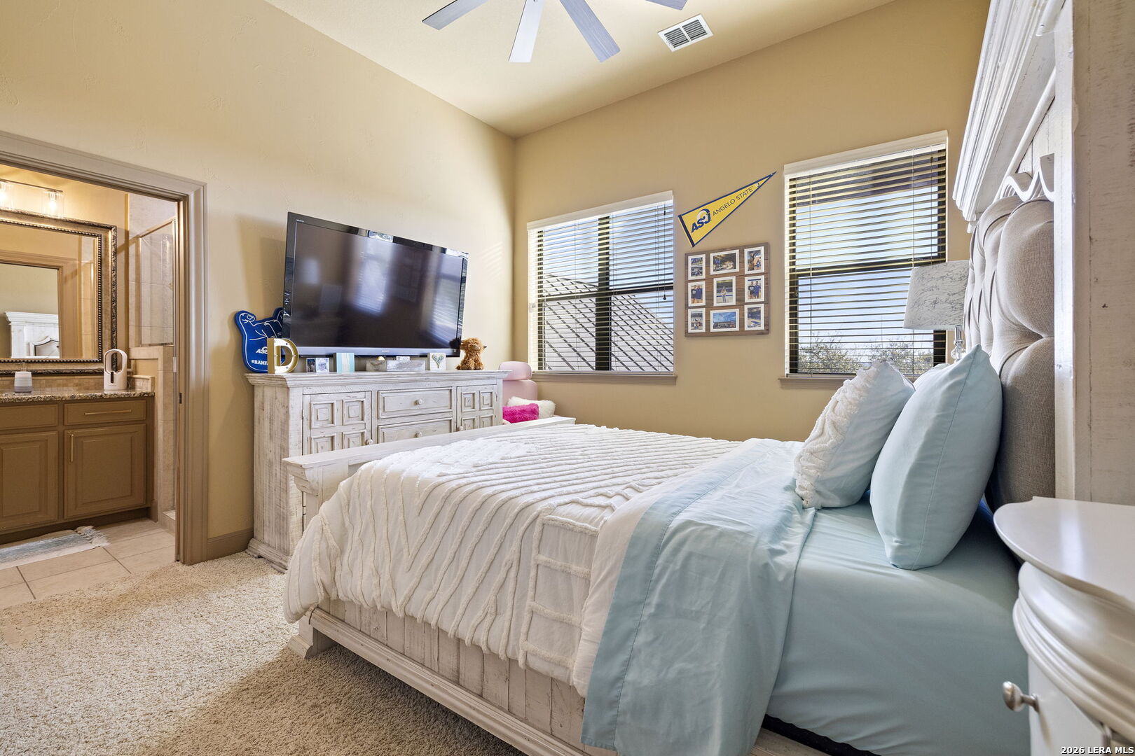 1941 Canyon Spring Branch, TX 78070 - Photo 39 of 86 a bedroom with a bed and a flat tv screen on dresser