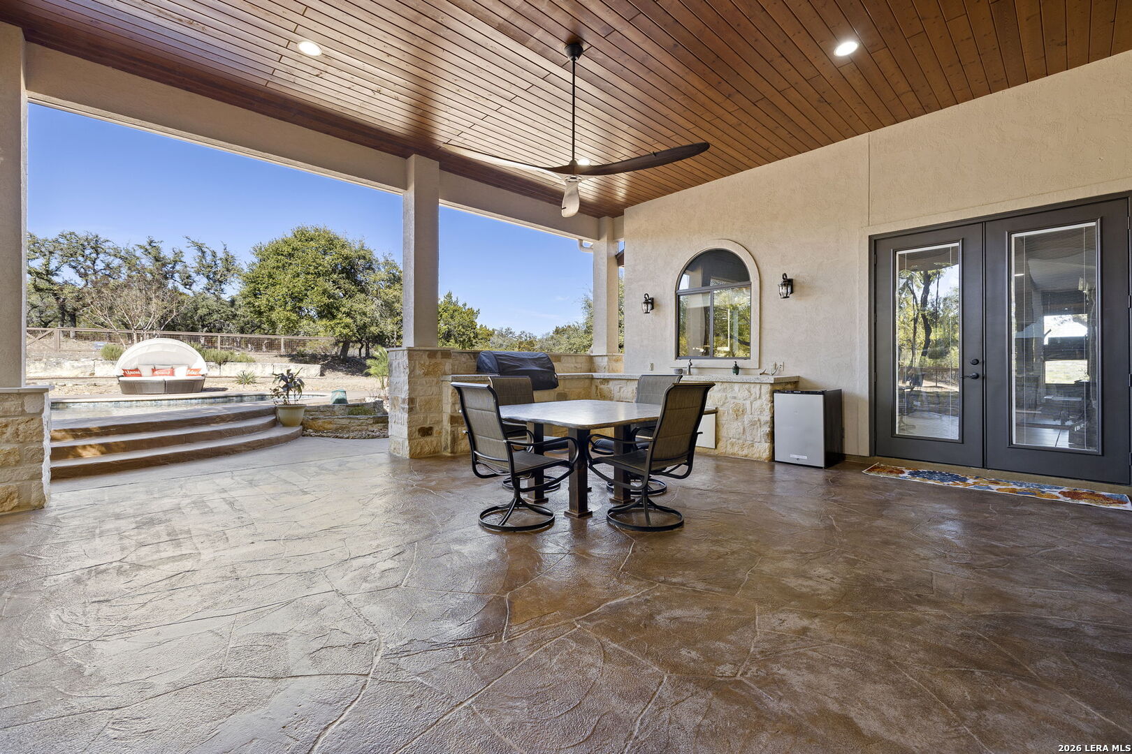 1941 Canyon Spring Branch, TX 78070 - Photo 50 of 86 a view of a patio with dining table and chairs with a small yard