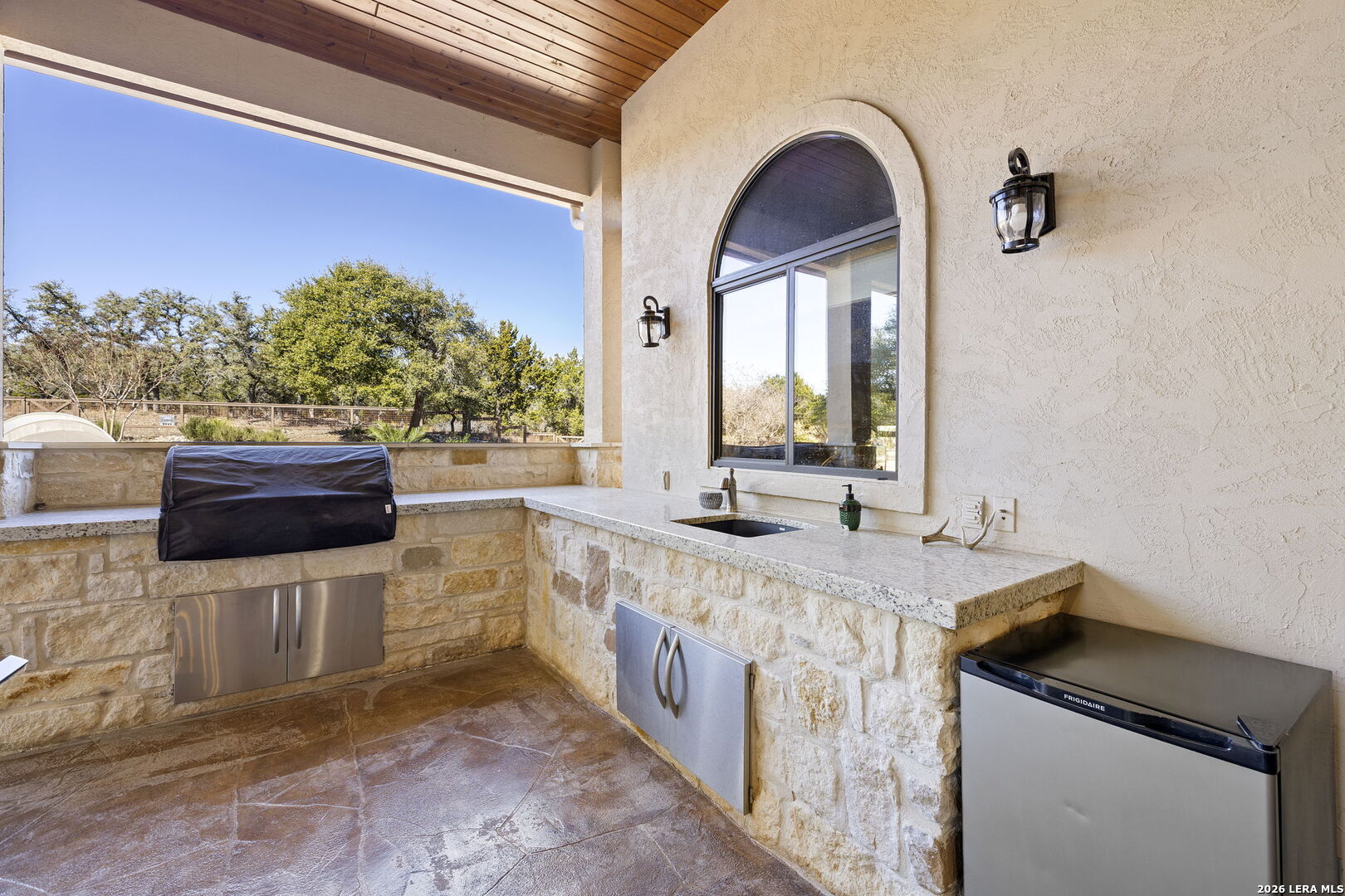 1941 Canyon Spring Branch, TX 78070 - Photo 54 of 86 a kitchen with stainless steel appliances granite countertop a sink and a stove