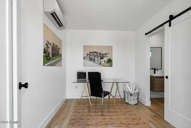 a view of a workspace with furniture
