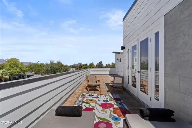 a view of balcony with furniture