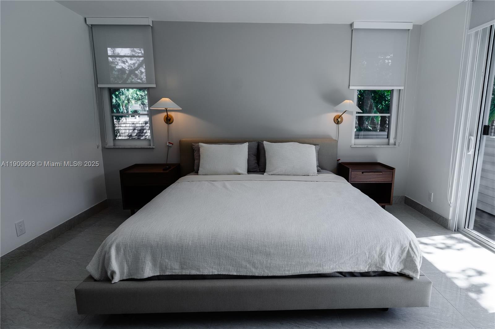 4017 North Cypress Drive, Unit 201 Pompano Beach, FL 33069 - Photo 19 of 44 a bedroom with a bed and window