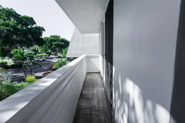 a view of balcony and yard