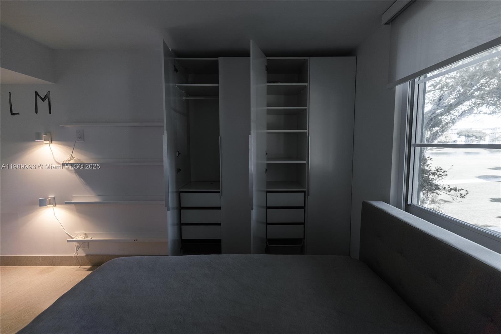 4017 North Cypress Drive, Unit 201 Pompano Beach, FL 33069 - Photo 33 of 44 a view of walk in closet with window