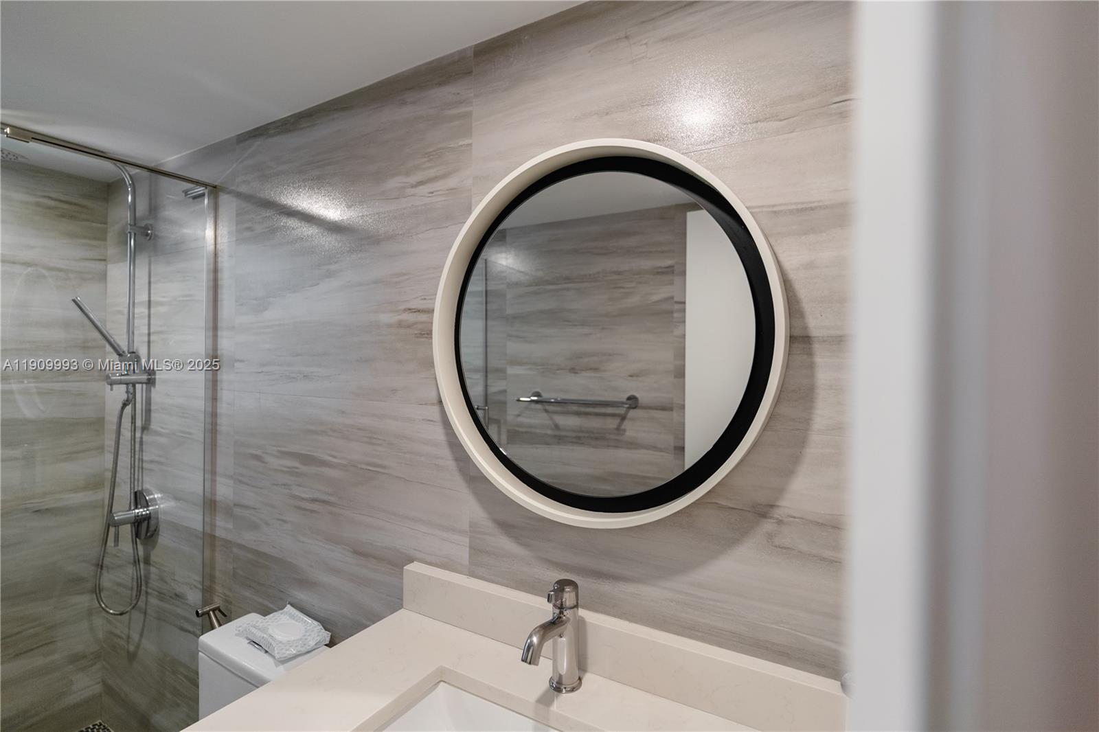 4017 North Cypress Drive, Unit 201 Pompano Beach, FL 33069 - Photo 34 of 44 a bathroom with a sink and a mirror