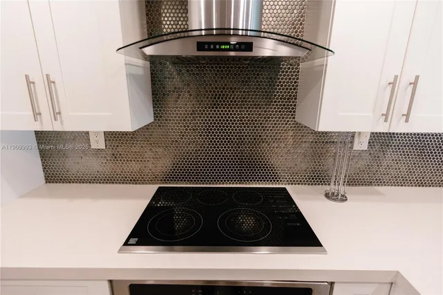 a bathroom with a granite countertop sink