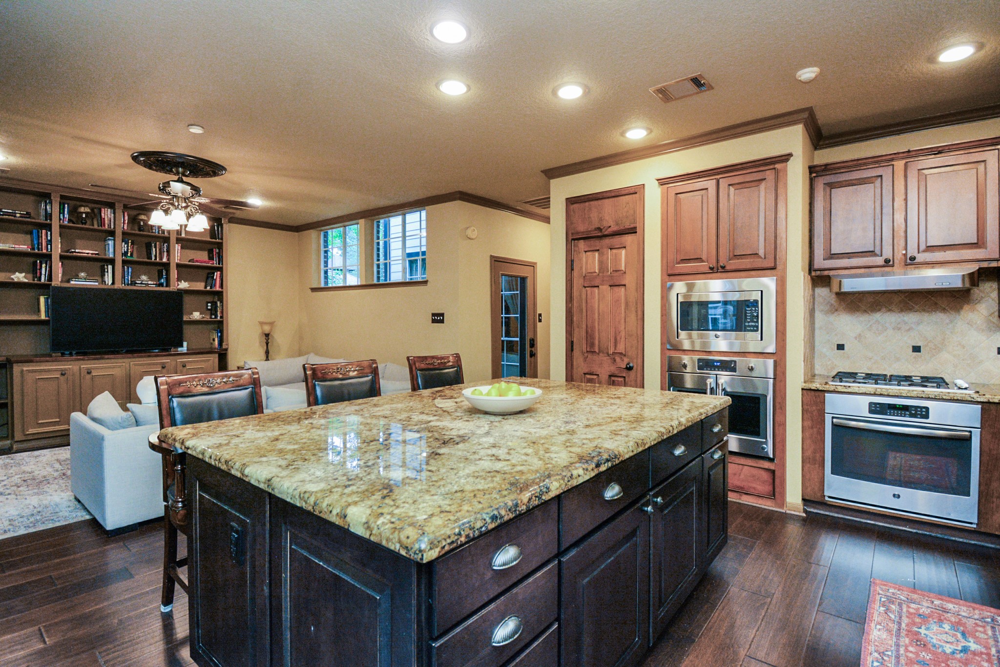 12906 Kingsbridge Lane Houston, TX 77077 - Photo 12 of 32 a kitchen with center island and stainless steel appliances