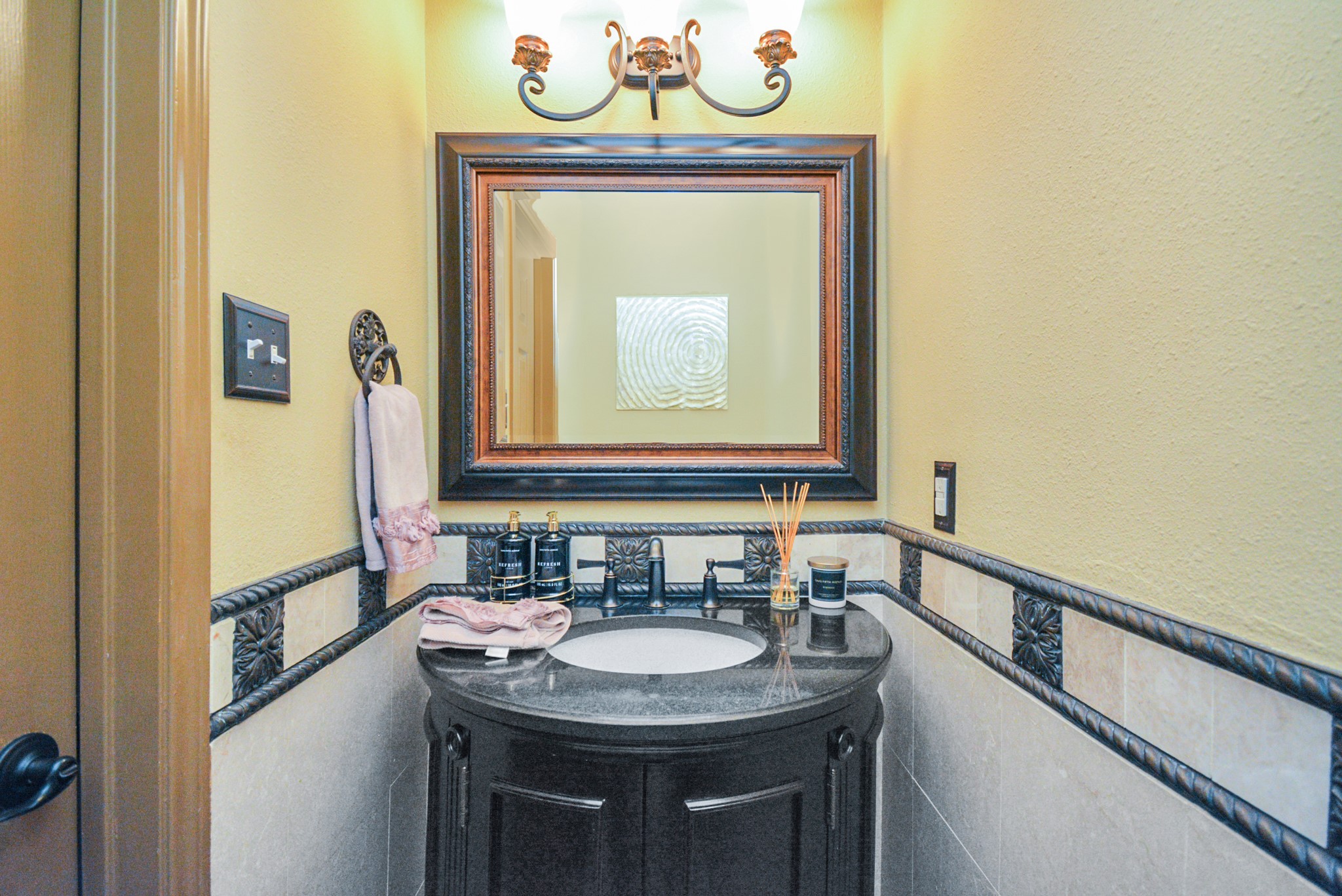 12906 Kingsbridge Lane Houston, TX 77077 - Photo 10 of 32 a bathroom with a sink and a mirror