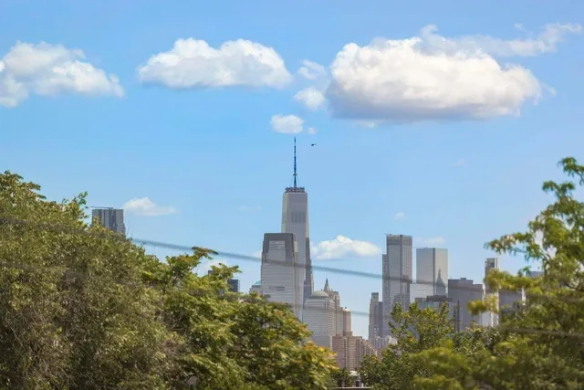 a city view with tall buildings and a street