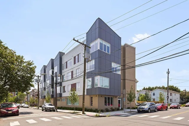 a city street lined with buildings and cars