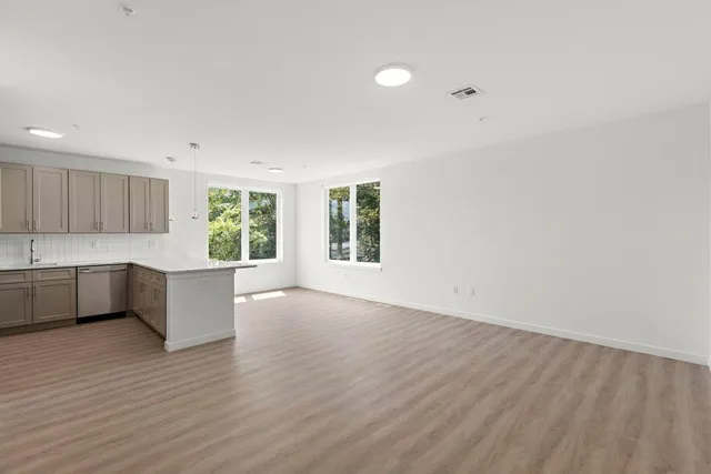 a view of kitchen and wooden floor
