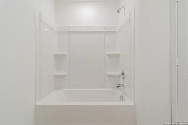 a close view of a bathtub in bathroom