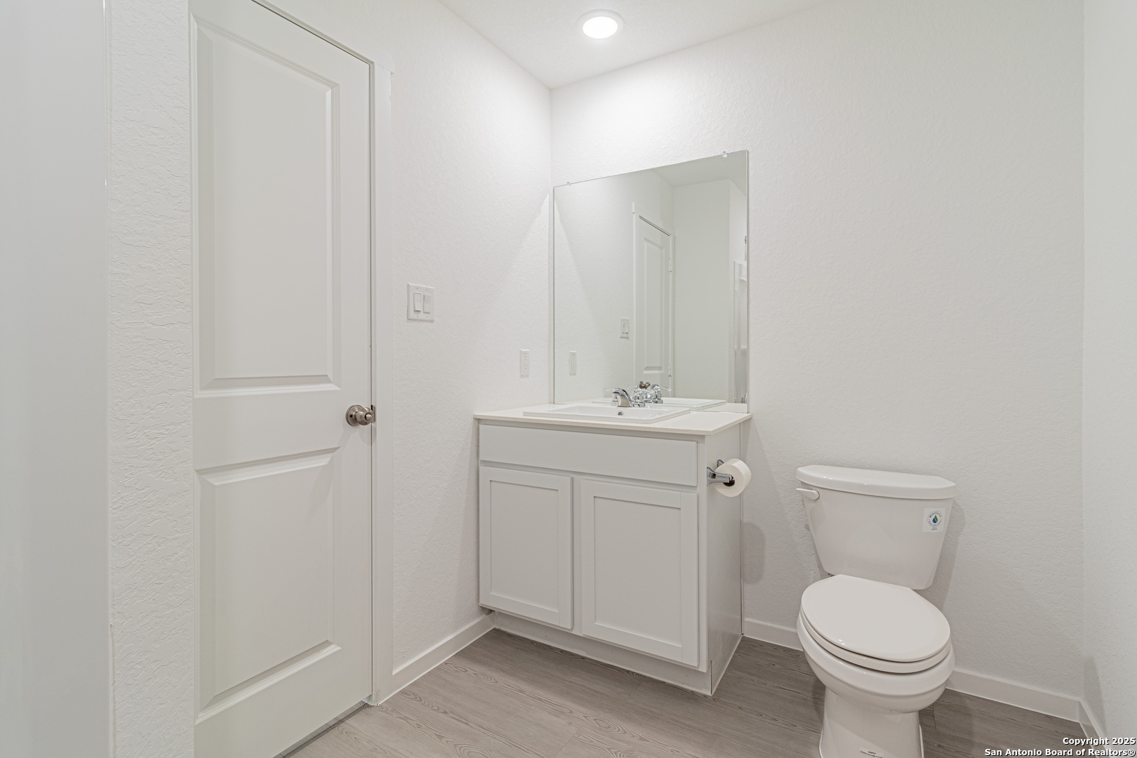 14610 Kayden Ridge San Antonio, TX 78253 - Photo 17 of 35 a bathroom with a toilet sink and mirror