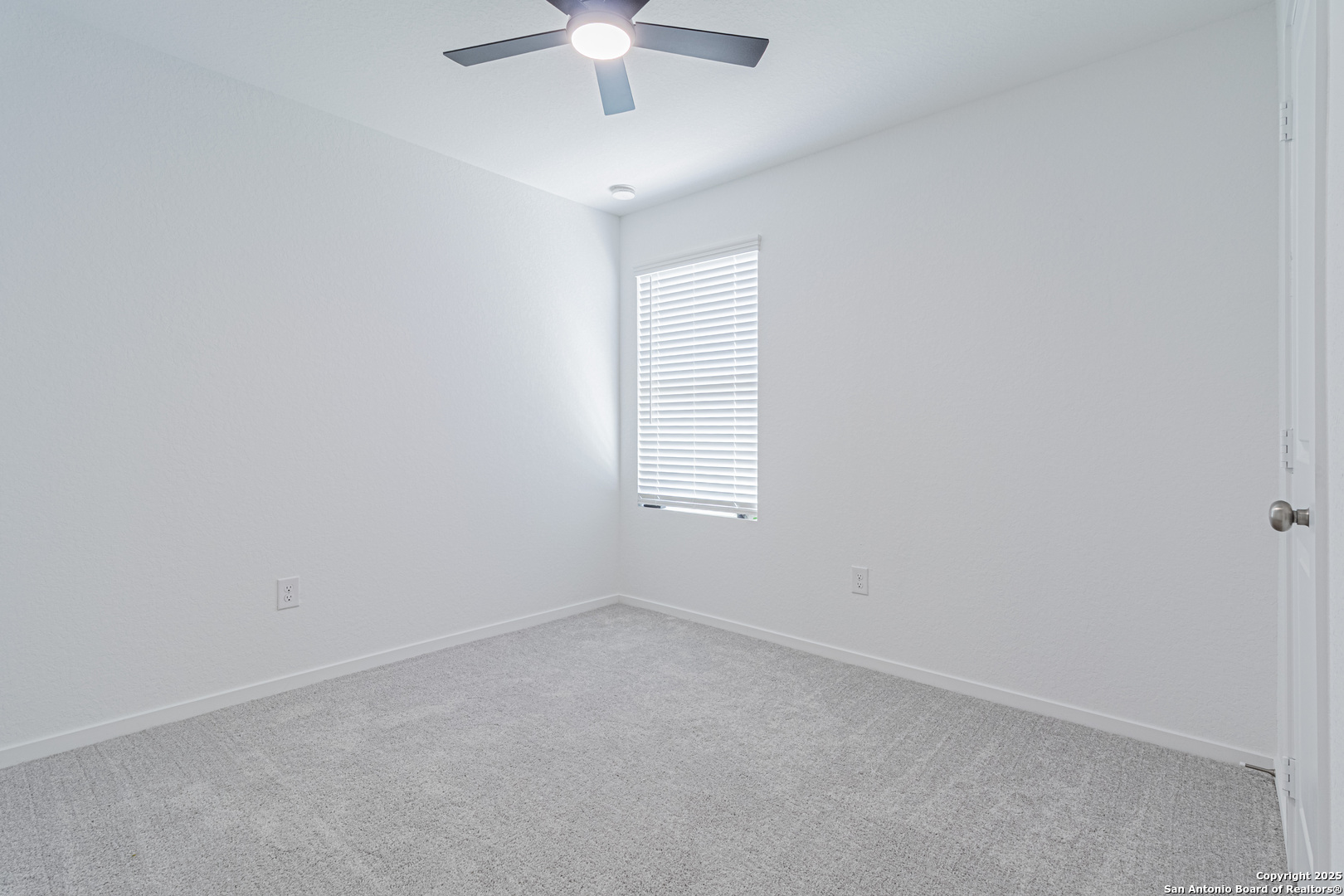 14610 Kayden Ridge San Antonio, TX 78253 - Photo 18 of 35 an empty room with a window and a ceiling fan