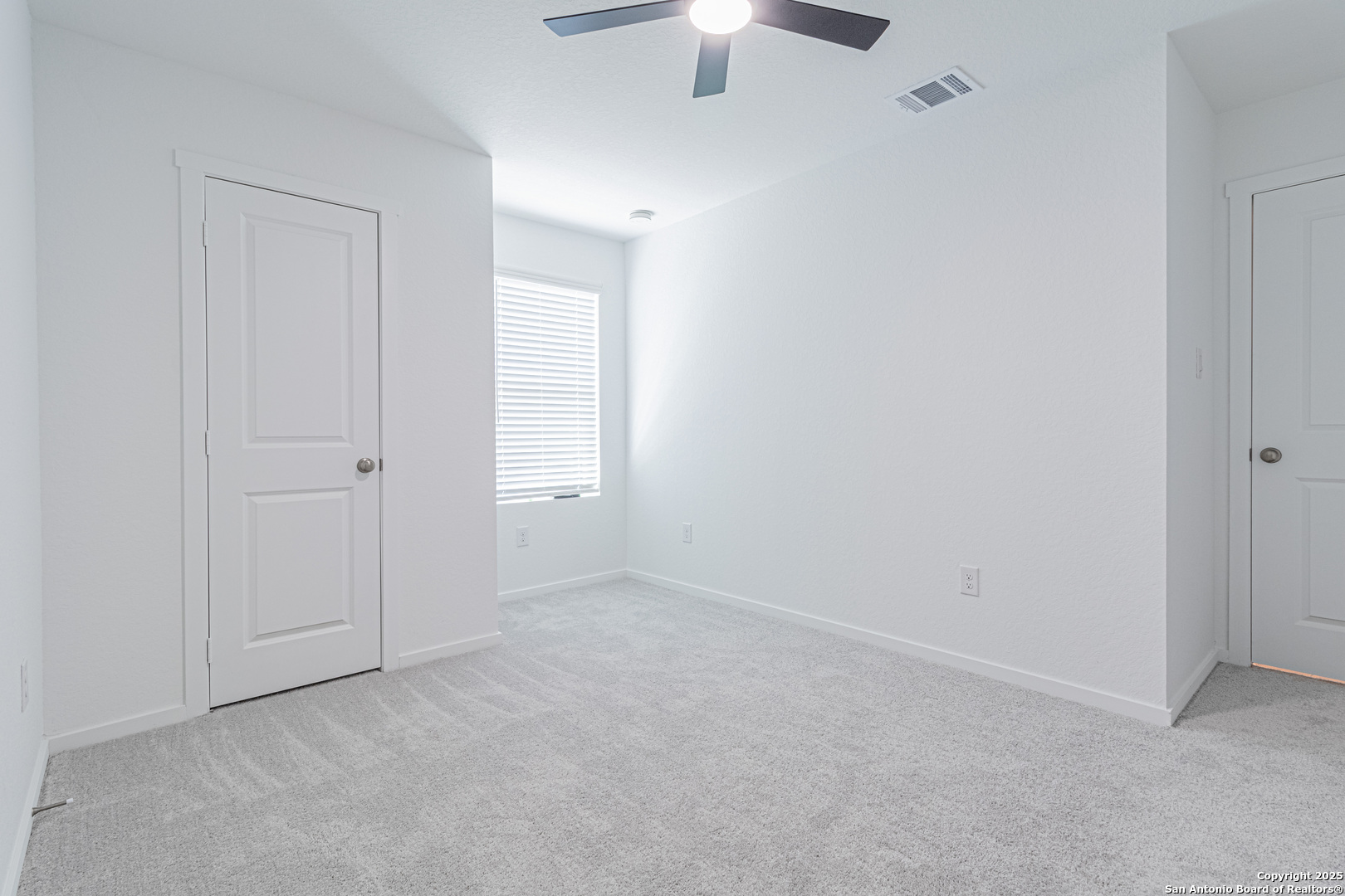 14610 Kayden Ridge San Antonio, TX 78253 - Photo 20 of 35 an empty room with a chandelier fan