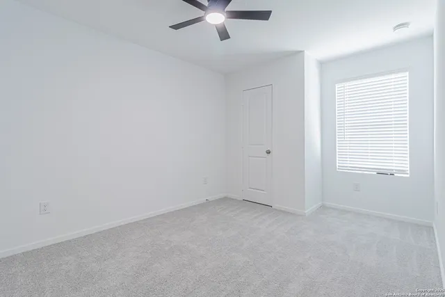 a bathroom with a shower a toilet and sink