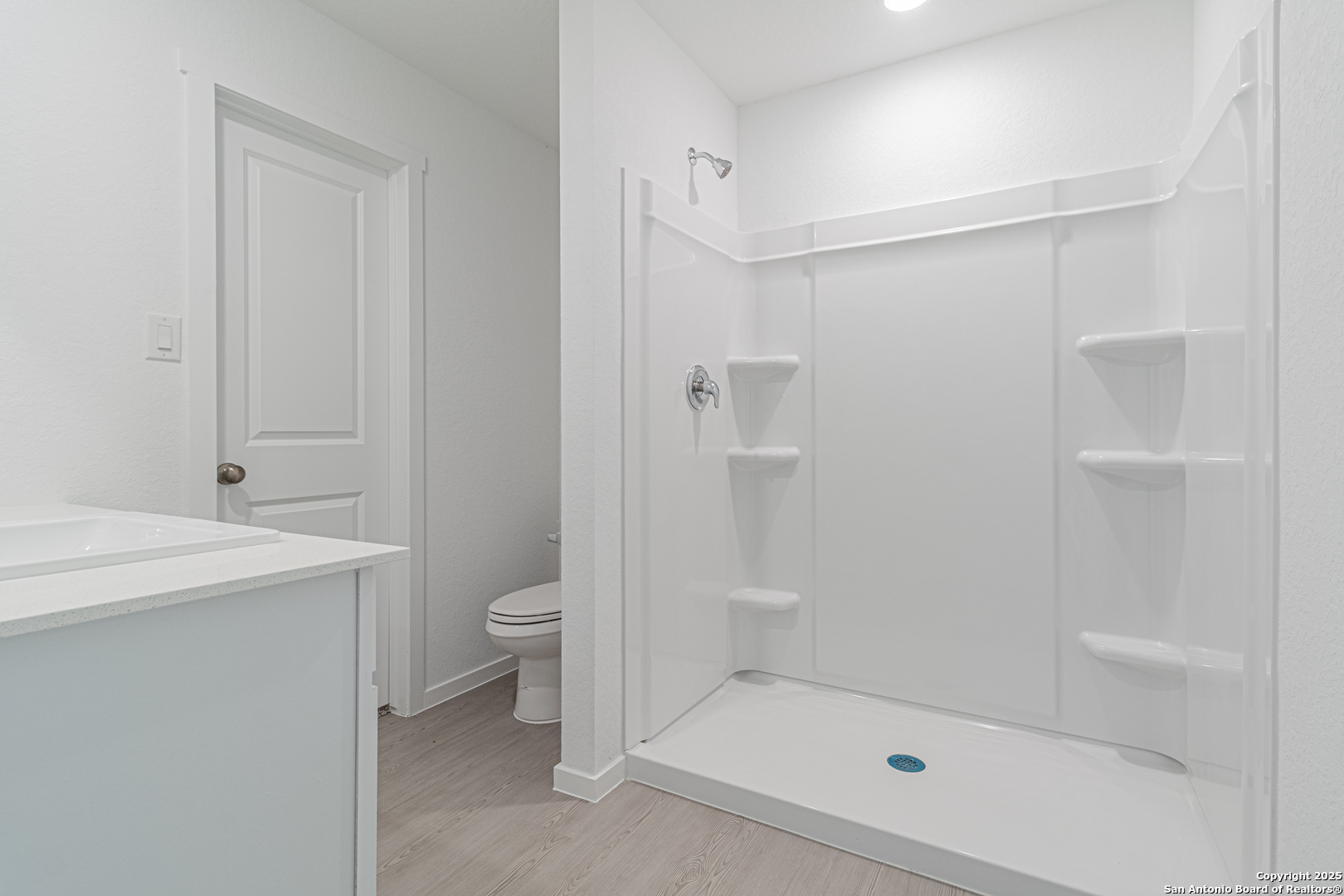 14610 Kayden Ridge San Antonio, TX 78253 - Photo 23 of 35 a bathroom with a shower a toilet and sink