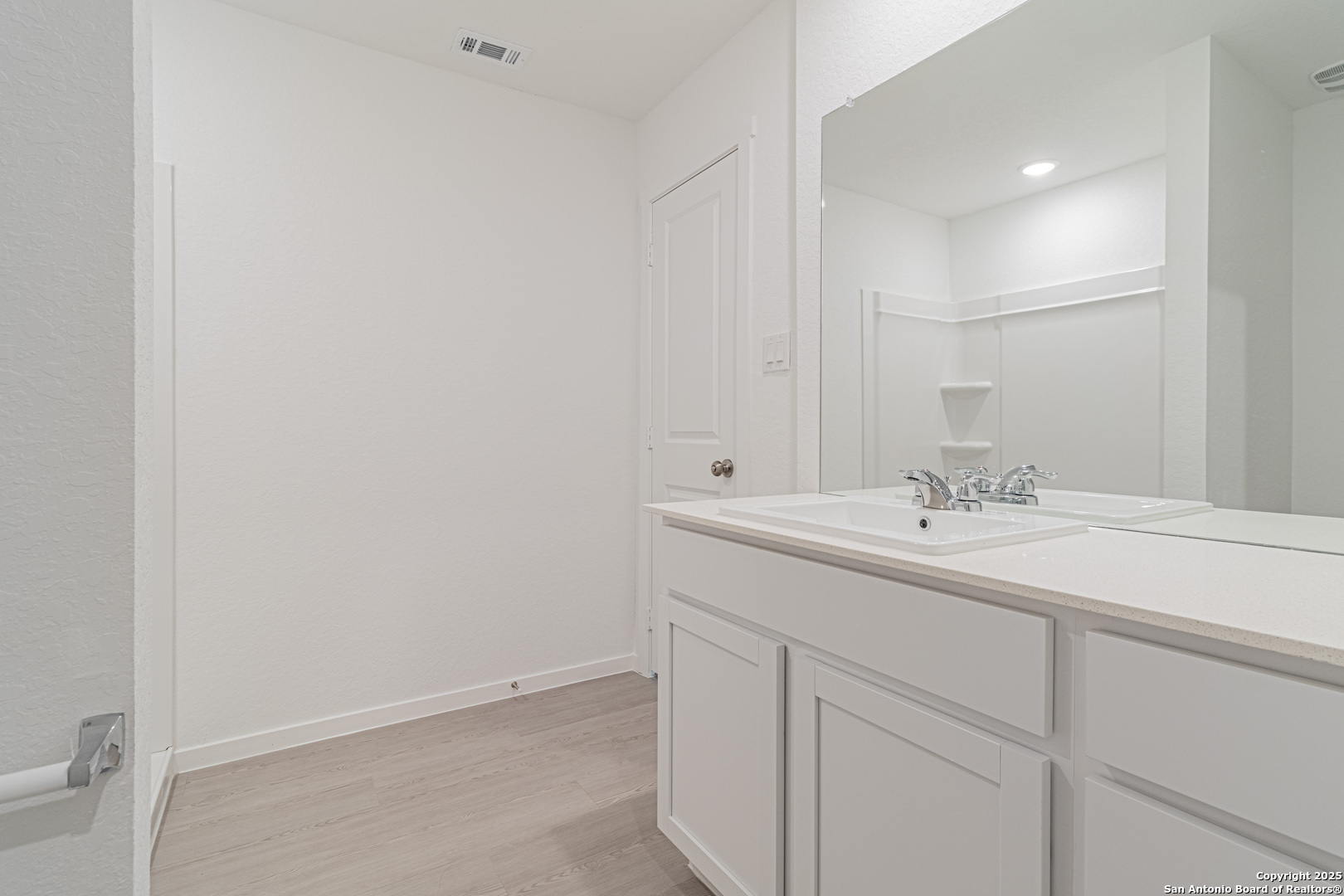 14610 Kayden Ridge San Antonio, TX 78253 - Photo 29 of 35 a bathroom with a sink and a mirror