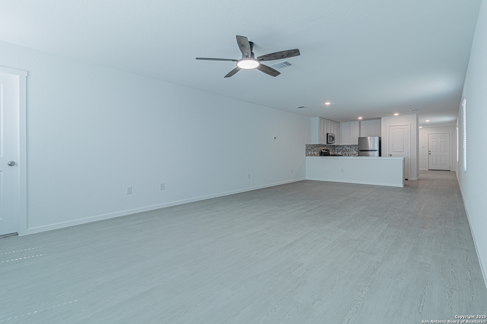 14610 Kayden Ridge San Antonio, TX 78253 - Photo 31 of 35 a view of a kitchen with a sink and a refrigerator