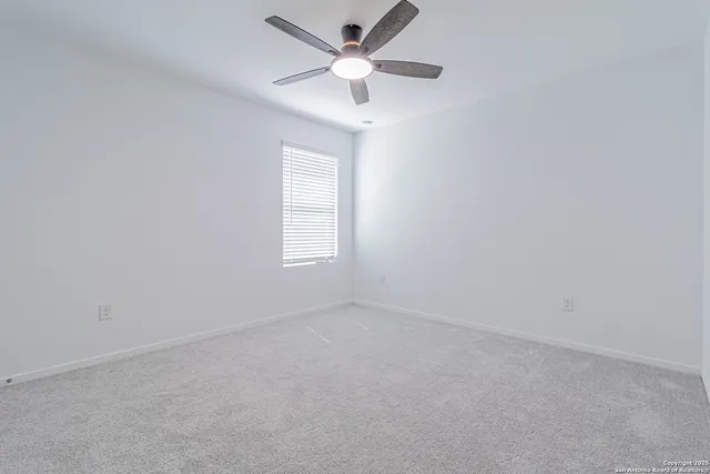 a view of a backyard with a garden and entertaining space