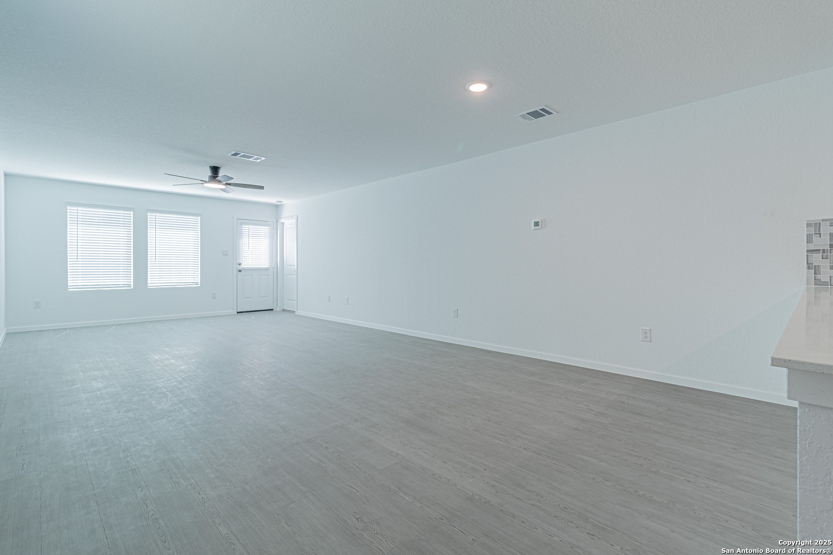 14610 Kayden Ridge San Antonio, TX 78253 - Photo 9 of 35 an empty room with windows and closet