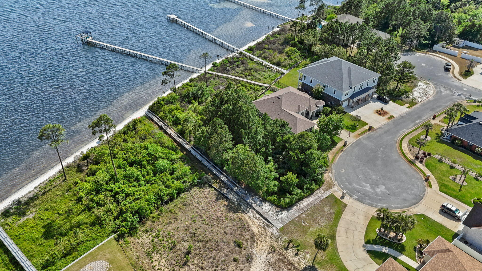 7475 Soundshore Drive Navarre, FL 32566 - Photo 12 of 35 an aerial view of a house with a yard