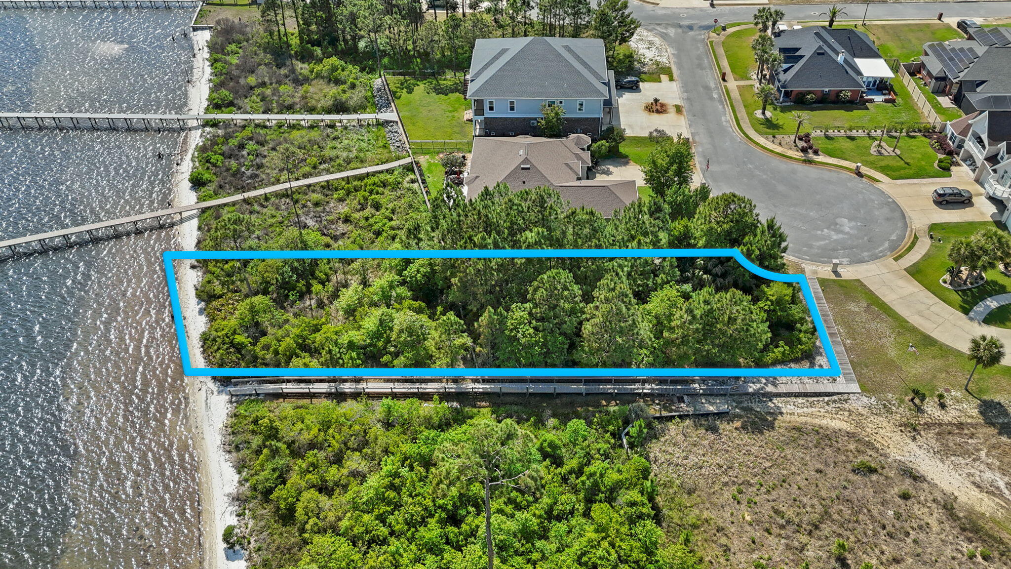 7475 Soundshore Drive Navarre, FL 32566 - Photo 13 of 35 a view of a yard with wooden fence