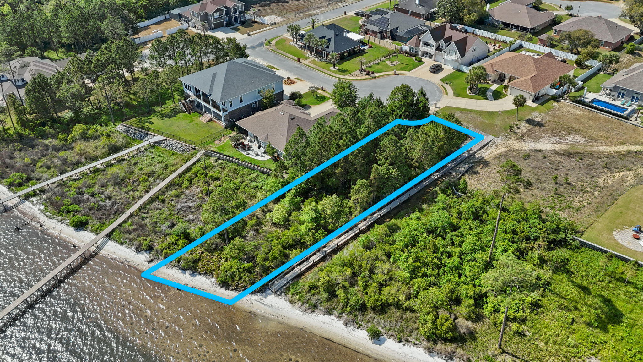 7475 Soundshore Drive Navarre, FL 32566 - Photo 15 of 35 an aerial view of a residential houses