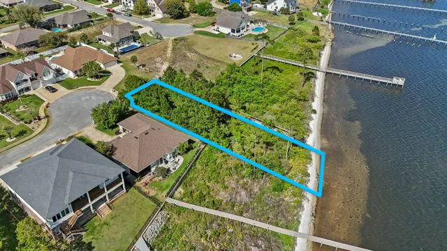 an aerial view of a house with yard