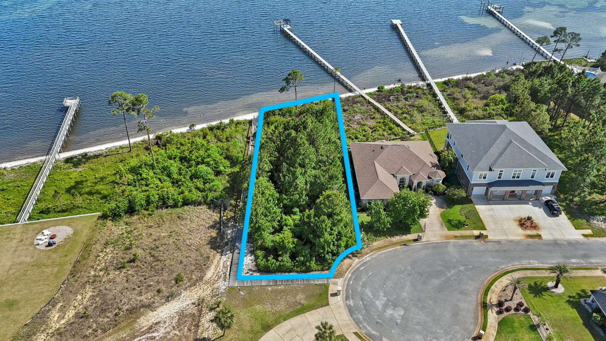 7475 Soundshore Drive Navarre, FL 32566 - Photo 4 of 35 a view of a swimming pool with a patio