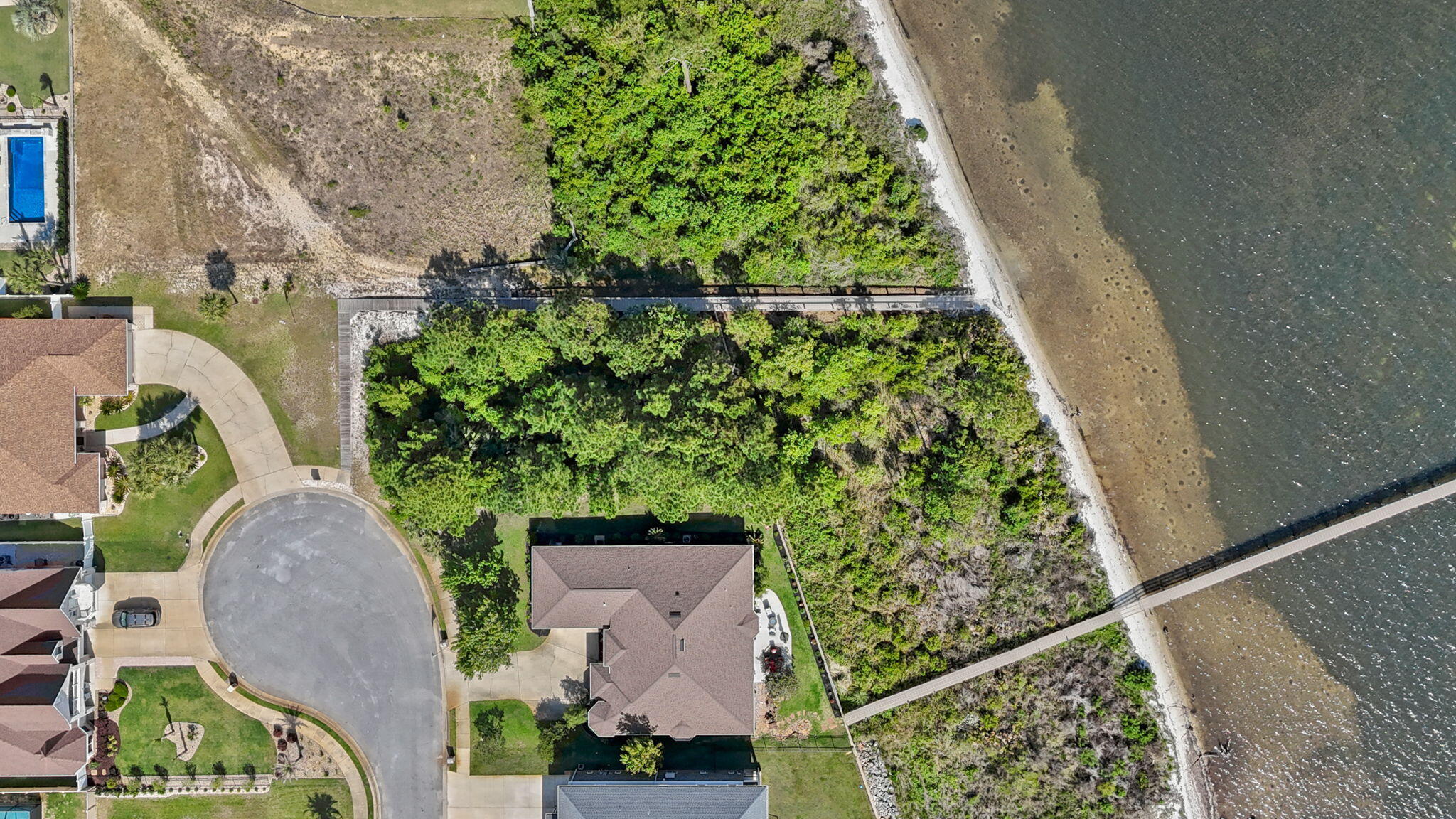 7475 Soundshore Drive Navarre, FL 32566 - Photo 10 of 35 an aerial view of a garden