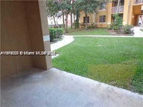 777 Southwest 111th Way, Unit 104 Pembroke Pines, FL 33025 - Photo 14 of 20 a view of a park with large trees