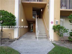 777 Southwest 111th Way, Unit 104 Pembroke Pines, FL 33025 - Photo 19 of 20 an entrance view of a house