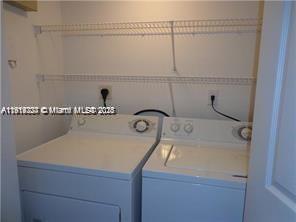 777 Southwest 111th Way, Unit 104 Pembroke Pines, FL 33025 - Photo 8 of 20 a utility room with dryer and washer