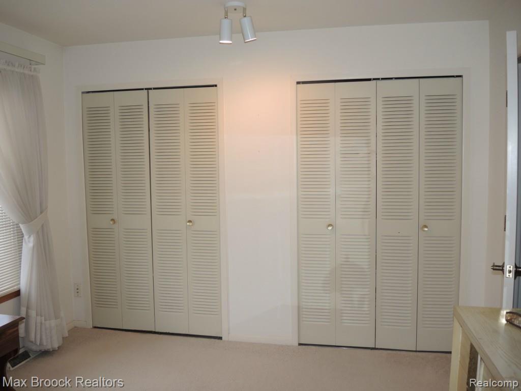 455 Baldwin Avenue, Unit 31 Rochester, MI 48307 - Photo 13 of 19 WALL OF CLOSETS IN MASTER BEDROOM