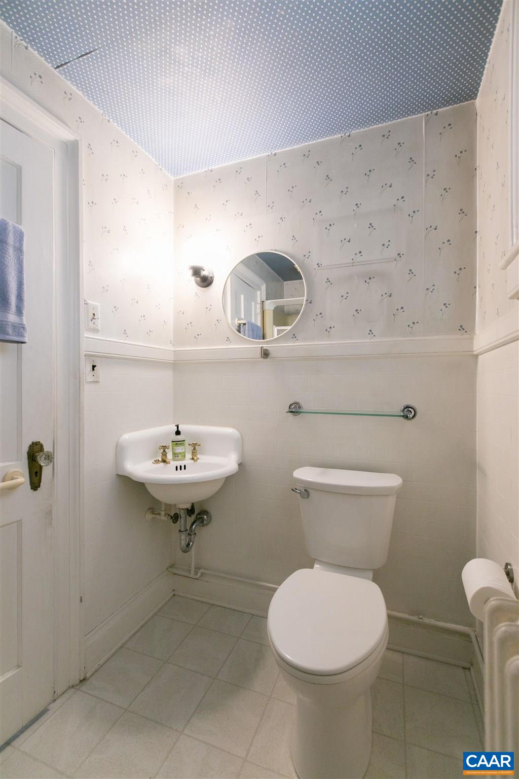 1102 Rugby Road Charlottesville, VA 22903 - Photo 25 of 51 a bathroom with a sink a toilet and mirror