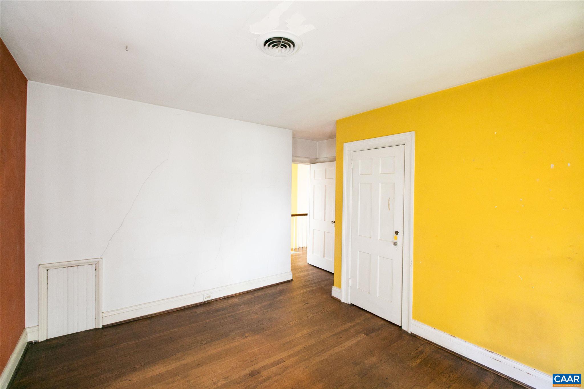 1102 Rugby Road Charlottesville, VA 22903 - Photo 39 of 51 a view of an empty room with wooden floor