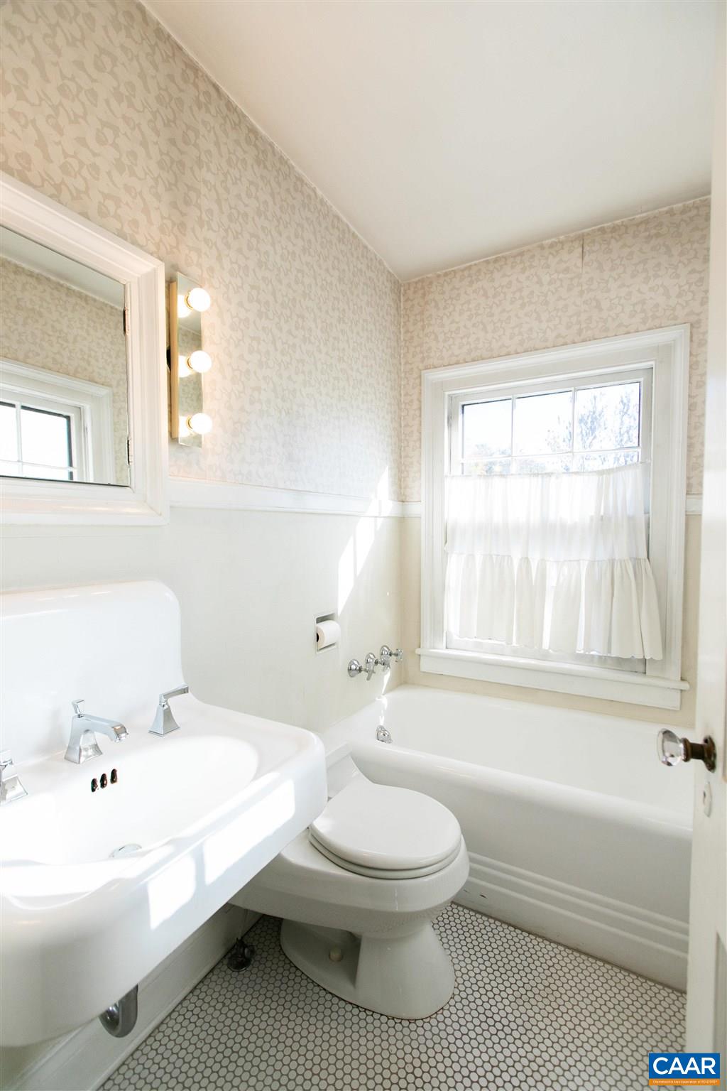 1102 Rugby Road Charlottesville, VA 22903 - Photo 43 of 51 a bathroom with a sink a toilet and bathtub