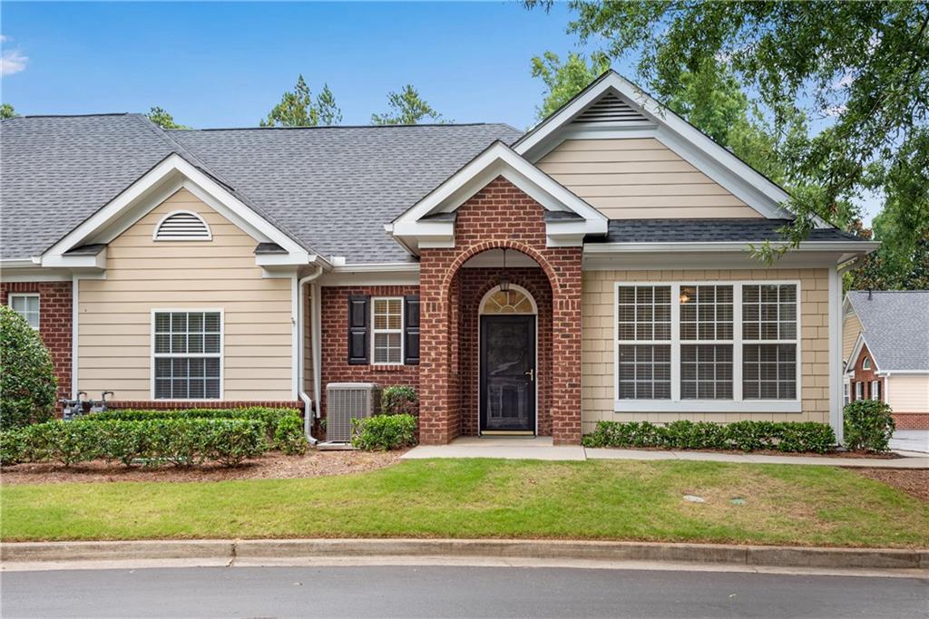 1602 Village Lane Roswell, GA 30075 - Photo 1 of 1 front view of a house and a yard