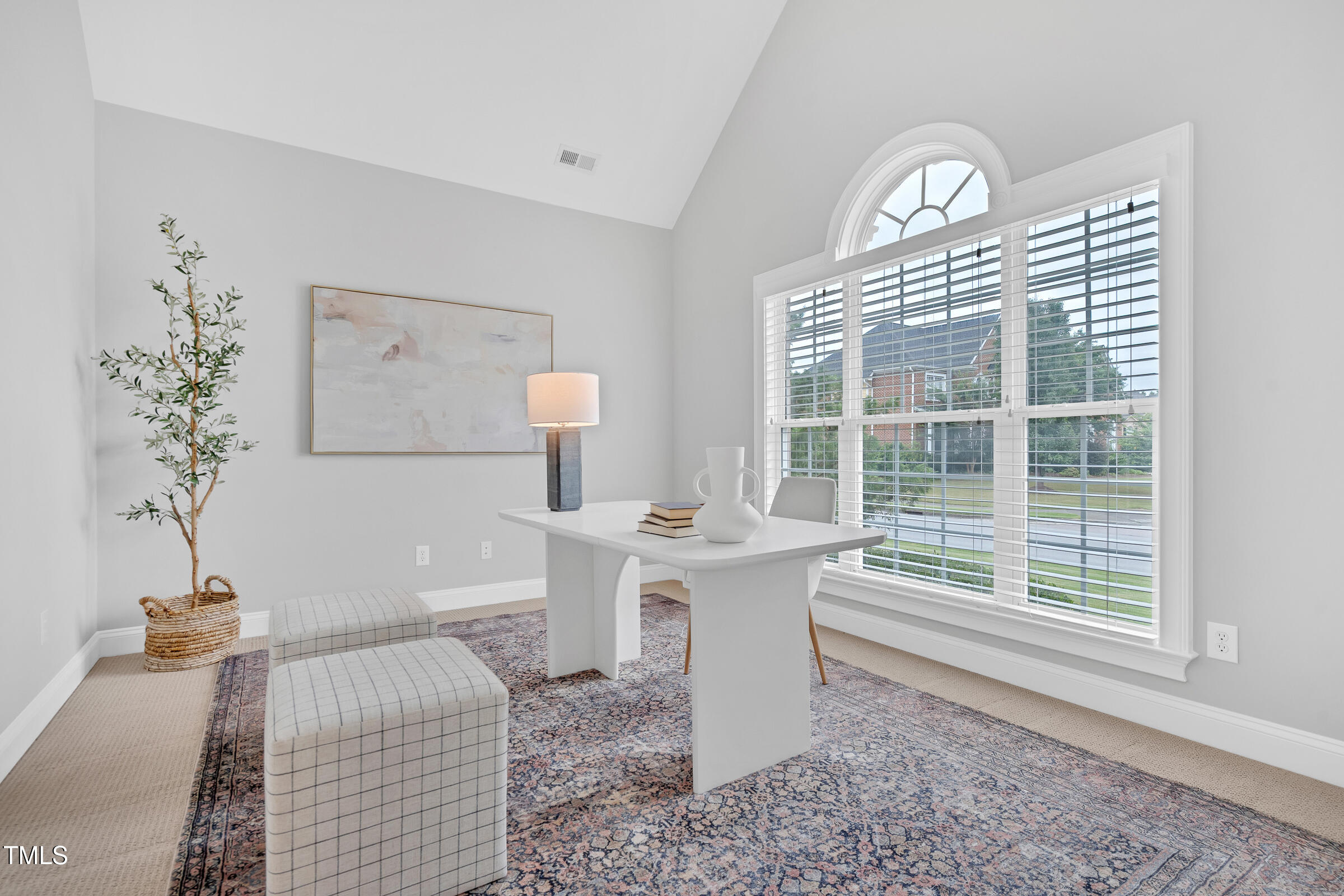 216 Creststone Drive Cary, NC 27519 - Photo 4 of 19 a view of a room that has a couch and a table in it