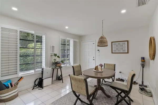 a work room with furniture and windows