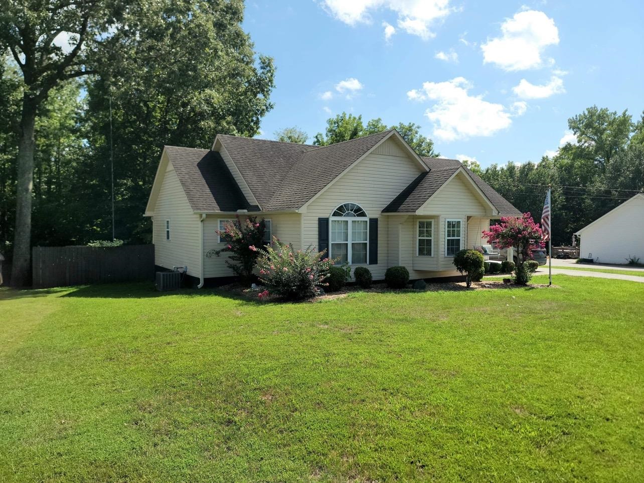 173 Chisholm Lake Road Ripley, TN 38063 - Photo 1 of 16 a front view of house with yard and green space