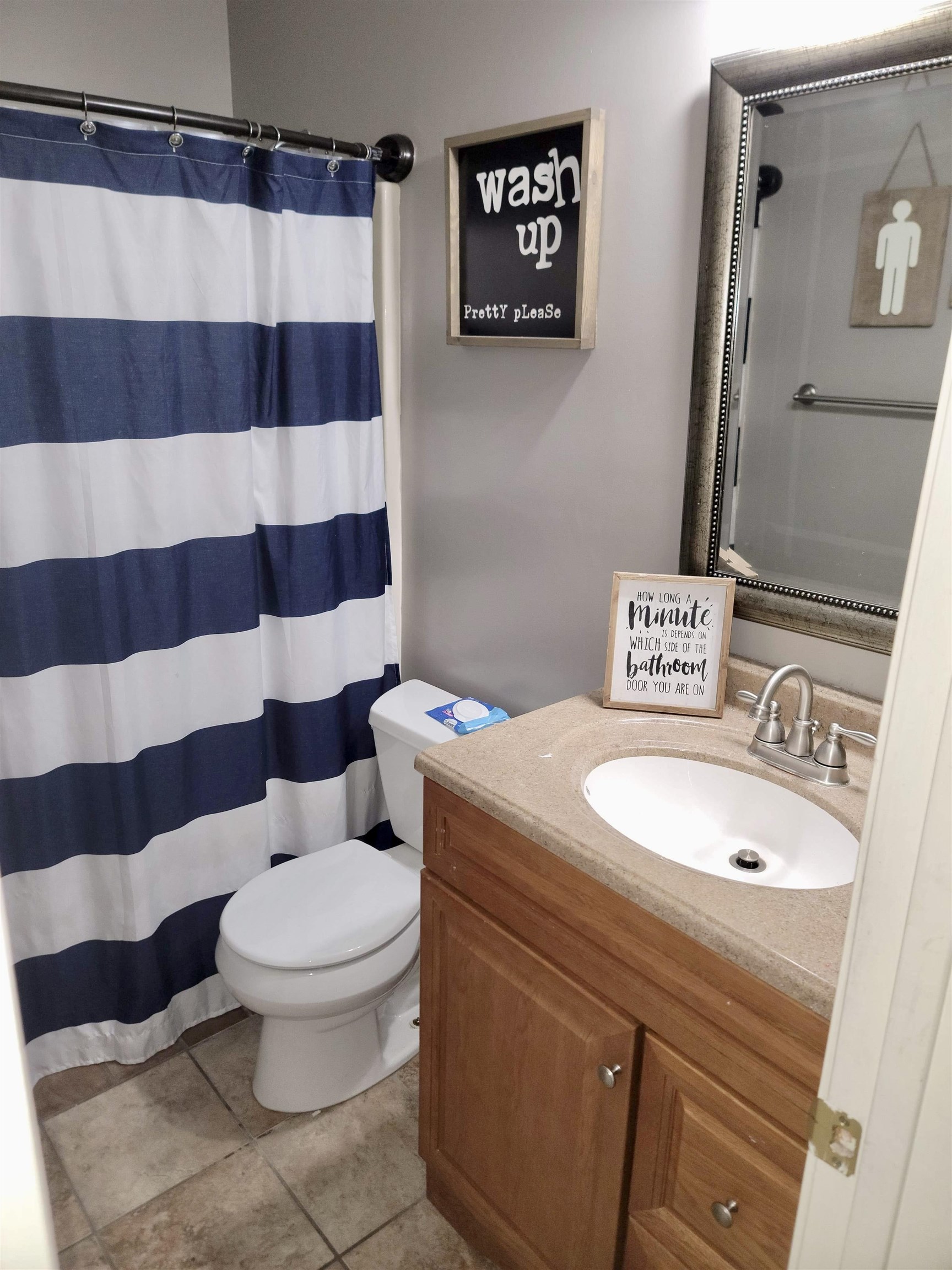 173 Chisholm Lake Road Ripley, TN 38063 - Photo 15 of 16 a white toilet sitting next to a shower curtain