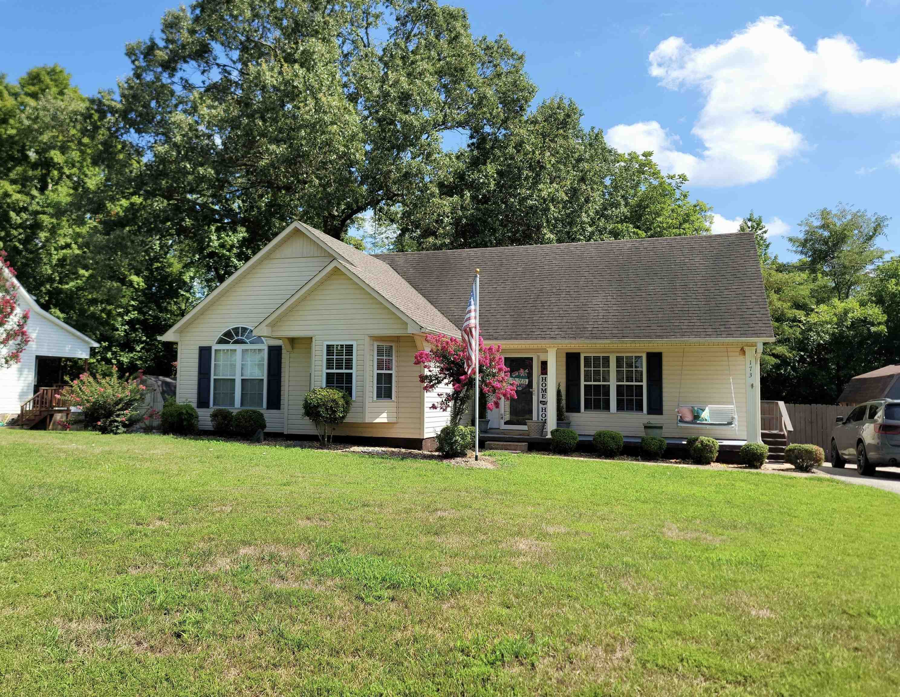 173 Chisholm Lake Road Ripley, TN 38063 - Photo 2 of 16 a front view of a house with a yard and trees