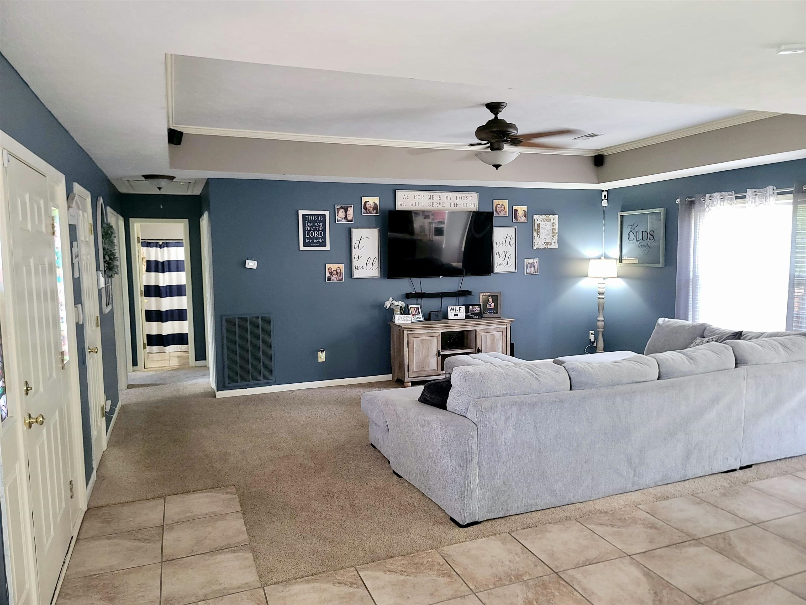 173 Chisholm Lake Road Ripley, TN 38063 - Photo 8 of 16 a living room with furniture and a flat screen tv