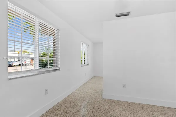 an empty room with windows